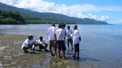 Physics students measuring ripples